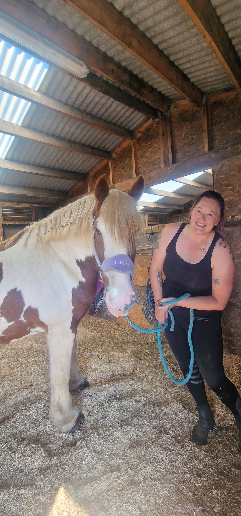 YardLoop's founder with one of her own horses in the barn